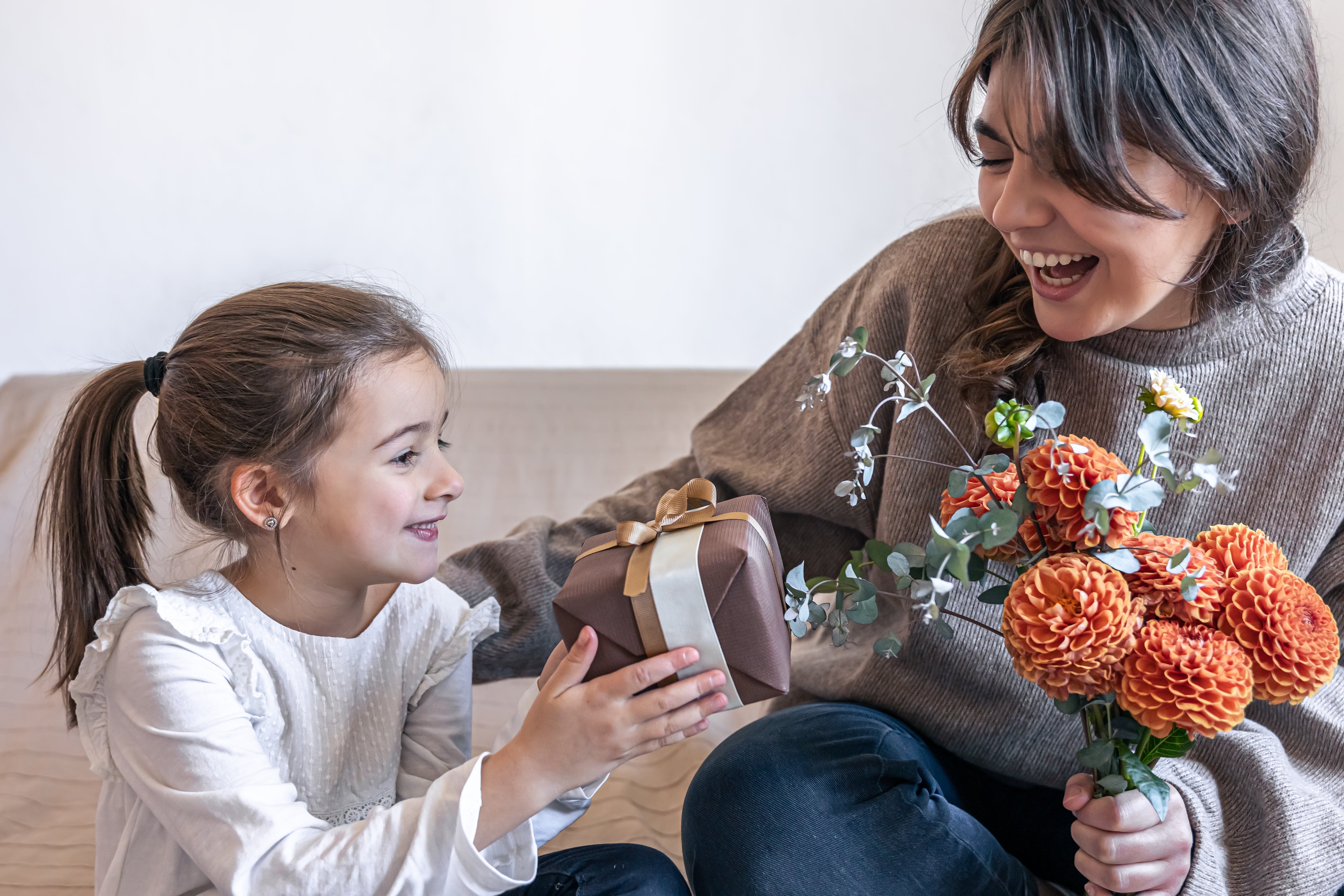Mother’s Day from Fixra featuring a smiling mom holding a DIY toolkit and car accessory products