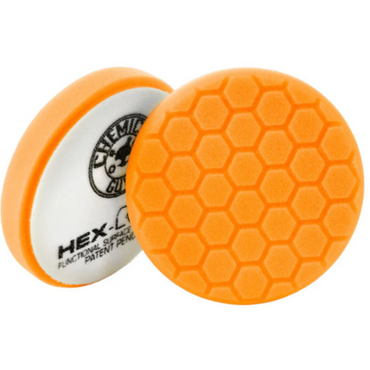 Orange 5.5-inch Chemical Guys Hex-Logic medium-heavy cutting pad with hexagonal surface pattern for polishing and paint correction