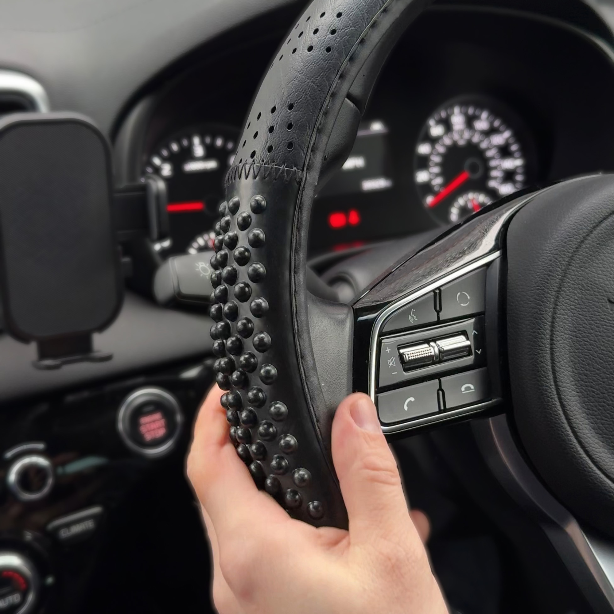 Black Massage Effect Steering Wheel Cover; ergonomic car accessory for comfort and improved grip