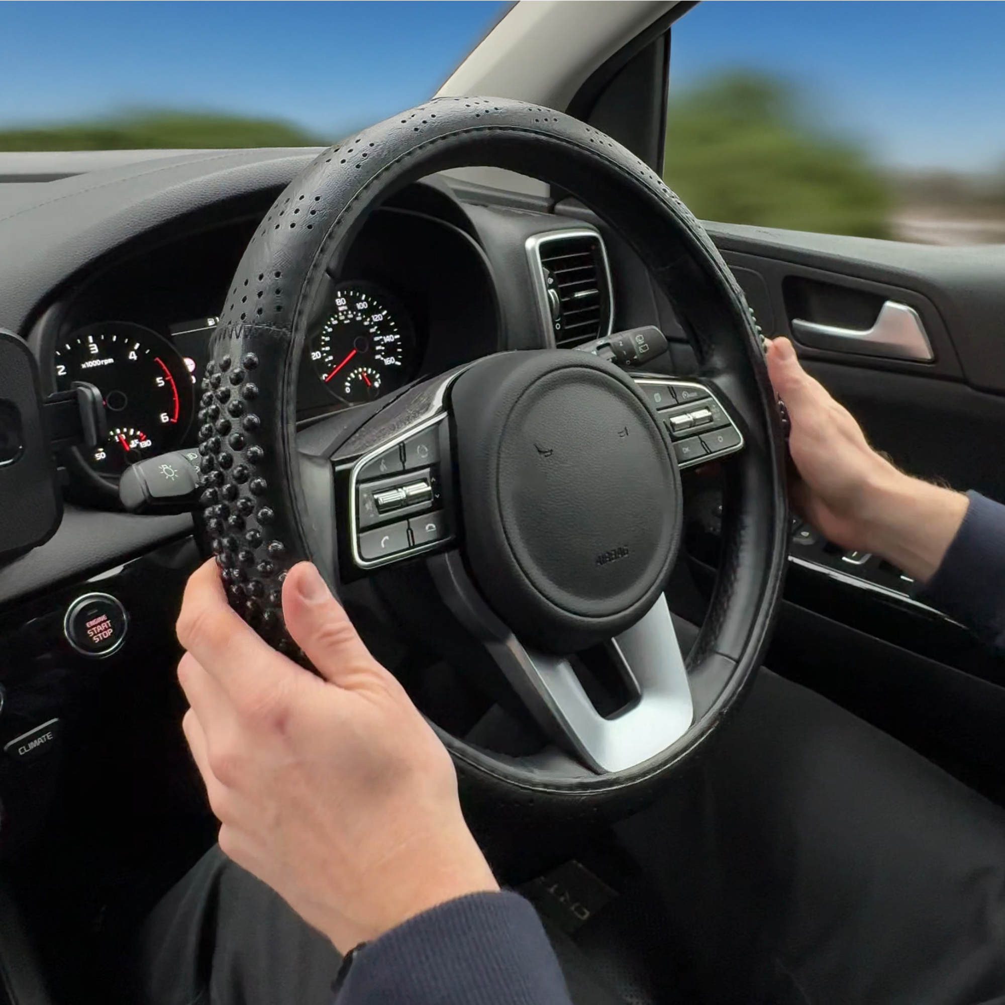 Black Massage Effect Steering Wheel Cover; ergonomic car accessory for comfort and improved grip